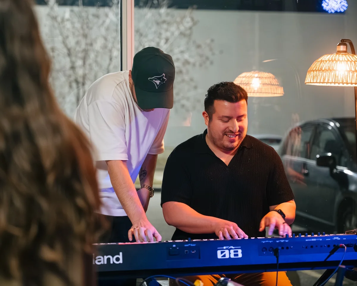 Two musicians at a keyboard at the Resonate After Hours Open Jam